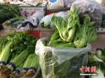 北京某便民超市销售的蔬菜。中新网 邱宇 摄 - News.Zynews.Com