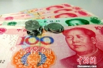 资料图：人民币。中新网记者 李金磊 摄 - News.Zynews.Com