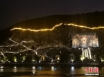 　图为夜幕下的龙门石窟。 中新社记者 刘鹏 摄 - 中国新闻社河南分社