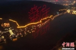 　图为无人机在龙门石窟上空组成新年快乐字样。　洛阳文旅集团 摄 - 中国新闻社河南分社