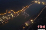 图为无人机在龙门石窟上空组成卢舍那大佛图案。　洛阳文旅集团 摄 - 中国新闻社河南分社